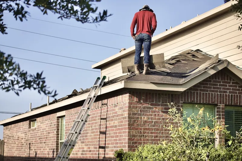 Professional roofer working on a residential roof in Lakeside Woods